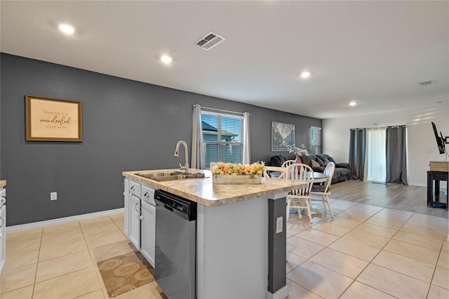 kitchen featuring white cabinetry, dishwasher, sink, a kitchen island with sink, and light tile patterned floors