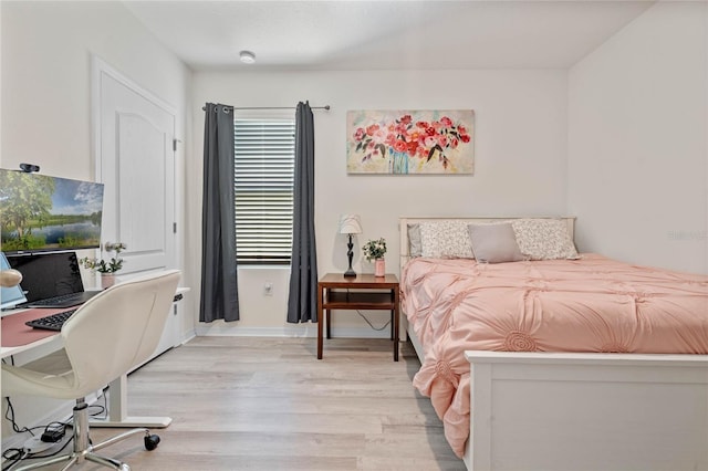 bedroom featuring light wood-type flooring