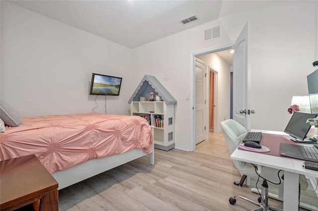 bedroom featuring light hardwood / wood-style floors