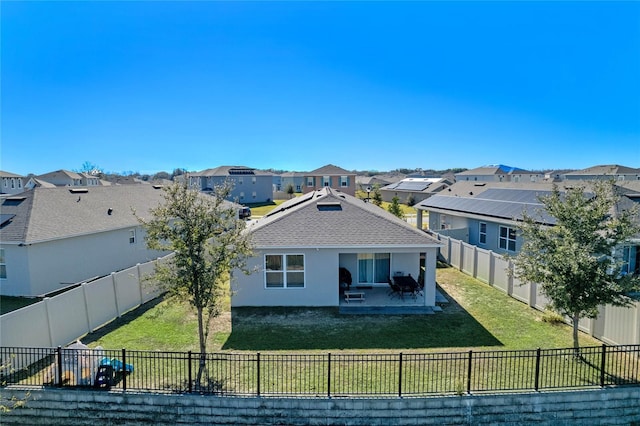 rear view of property with a patio area and a yard