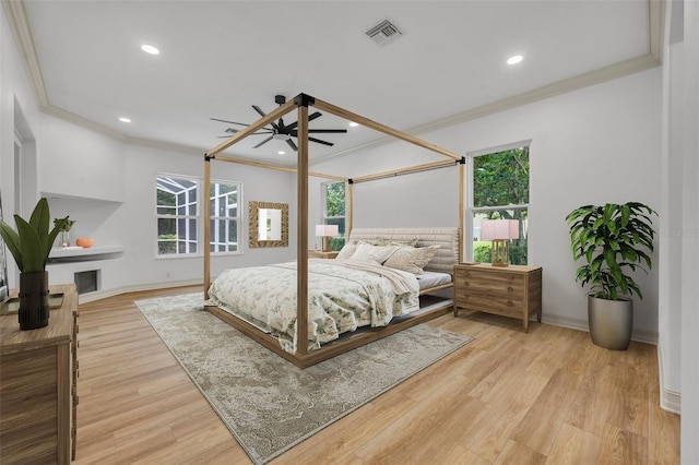 11941 Graces Way, Clermont, FL 34711 - bedroom with ornamental molding, light wood-style floors, recessed lighting, and a ceiling fan