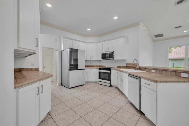 11941 Graces Way, Clermont, FL 34711 - kitchen with freestanding refrigerator, electric stove, dishwasher, ornamental molding, and a peninsula