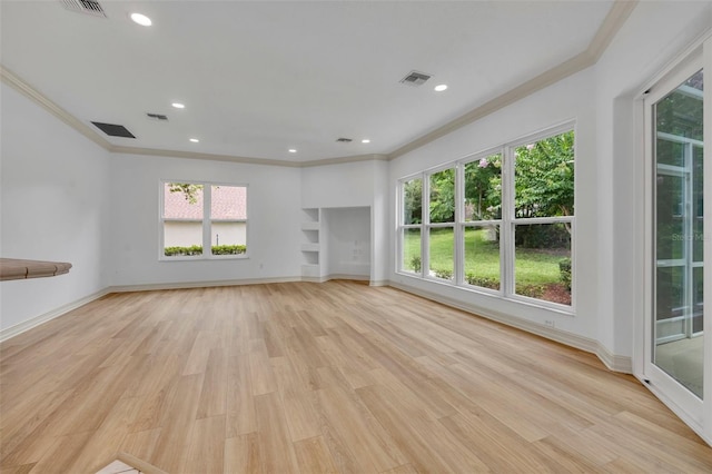 11941 Graces Way, Clermont, FL 34711 - unfurnished living room featuring crown molding, healthy amount of natural light, light wood-style flooring, and recessed lighting