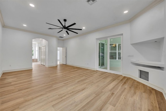 11941 Graces Way, Clermont, FL 34711 - unfurnished living room featuring arched walkways, ceiling fan, light wood-type flooring, ornamental molding, and recessed lighting