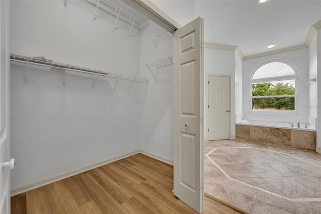 11941 Graces Way, Clermont, FL 34711 - spacious closet with wood finished floors