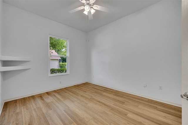 11941 Graces Way, Clermont, FL 34711 - empty room featuring wood finished floors and a ceiling fan