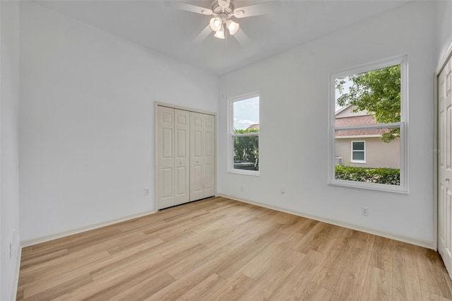 11941 Graces Way, Clermont, FL 34711 - unfurnished bedroom with light wood-type flooring and a ceiling fan