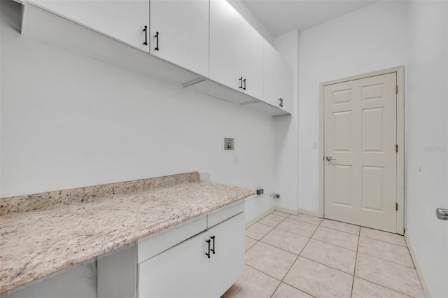 11941 Graces Way, Clermont, FL 34711 - laundry room featuring cabinet space, hookup for a washing machine, and light tile patterned floors