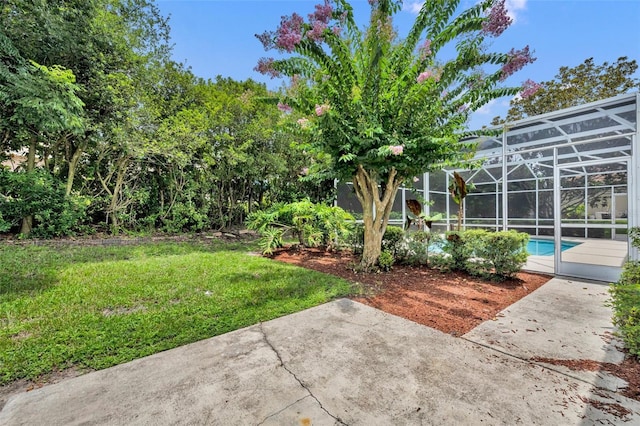 11941 Graces Way, Clermont, FL 34711 - view of grassy yard with a patio, an outdoor pool, and a lanai