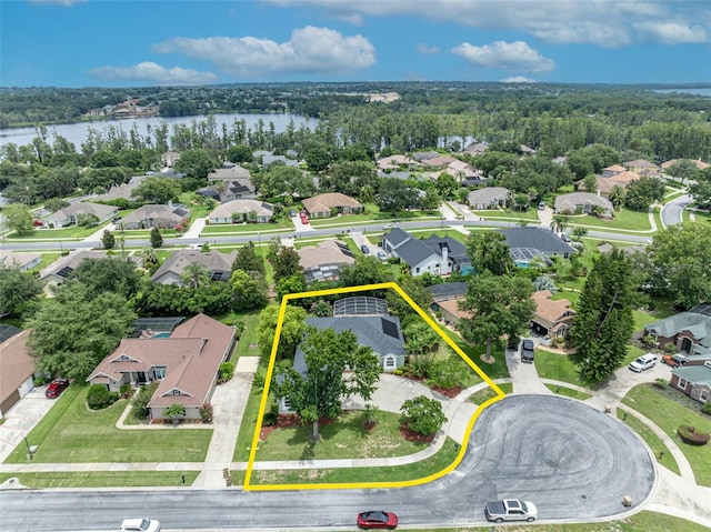11941 Graces Way, Clermont, FL 34711 - aerial view of residential area with property boundaries highlighted and a large body of water