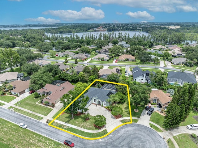 11941 Graces Way, Clermont, FL 34711 - aerial view of residential area with a large body of water and property parcel outlined