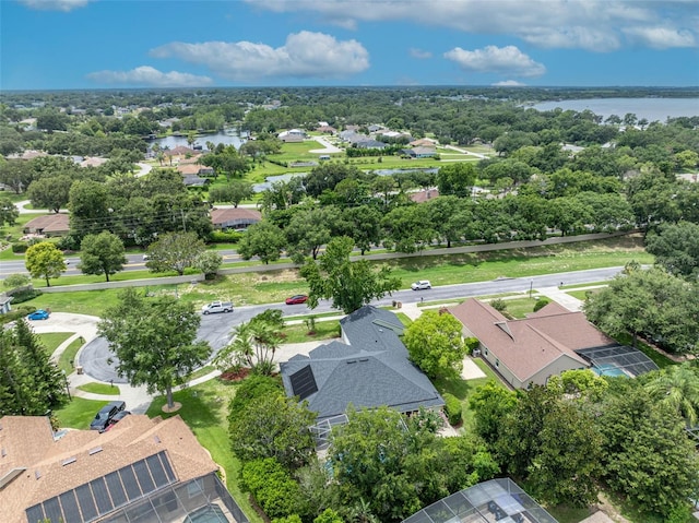 11941 Graces Way, Clermont, FL 34711 - aerial view of residential area with a nearby body of water and a tree filled landscape