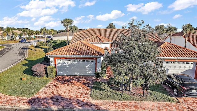 mediterranean / spanish-style home featuring a garage