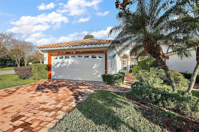 mediterranean / spanish-style home featuring a garage