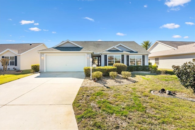 ranch-style house featuring a front yard and a garage