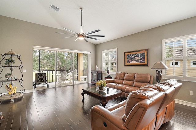 living room with ceiling fan and lofted ceiling