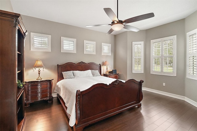 bedroom featuring ceiling fan and dark hardwood / wood-style floors