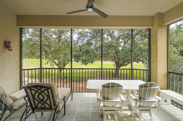 sunroom / solarium with ceiling fan