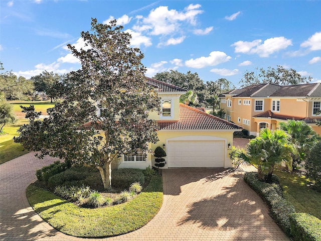 view of front of property with a garage