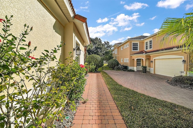 view of side of home with a garage