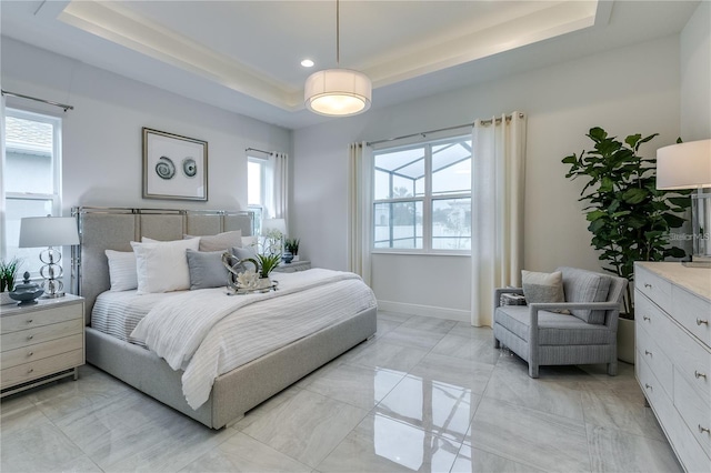 bedroom with a tray ceiling