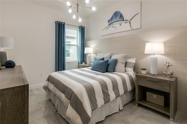 bedroom with a notable chandelier