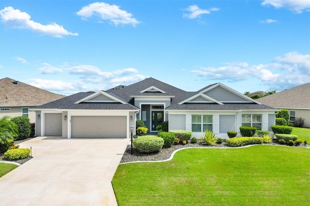 ranch-style house featuring a front yard and a garage