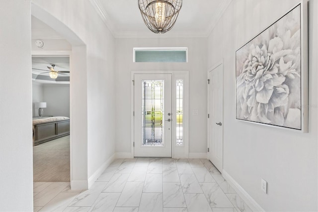 entryway with crown molding and ceiling fan with notable chandelier