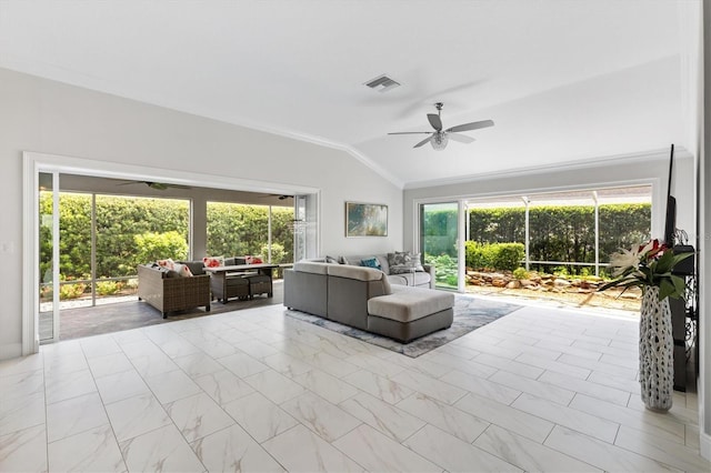 unfurnished living room with vaulted ceiling, ceiling fan, a healthy amount of sunlight, and crown molding