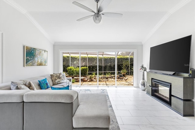 living room featuring ceiling fan, plenty of natural light, vaulted ceiling, and ornamental molding