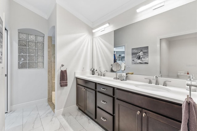 bathroom featuring crown molding, vanity, and walk in shower