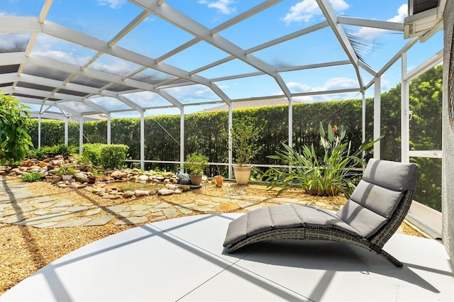 view of patio / terrace featuring a lanai