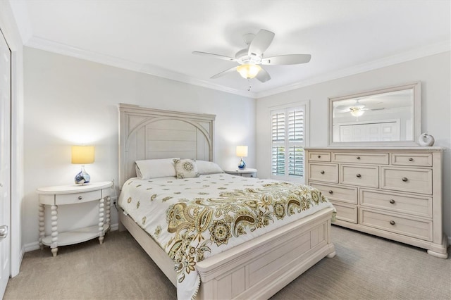 carpeted bedroom featuring ceiling fan and ornamental molding