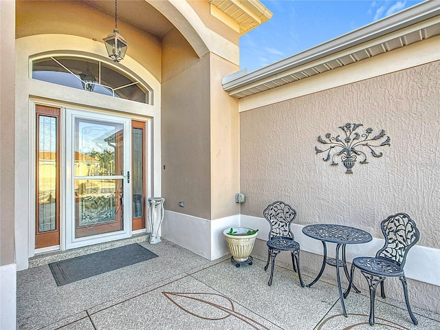 doorway to property featuring a patio area