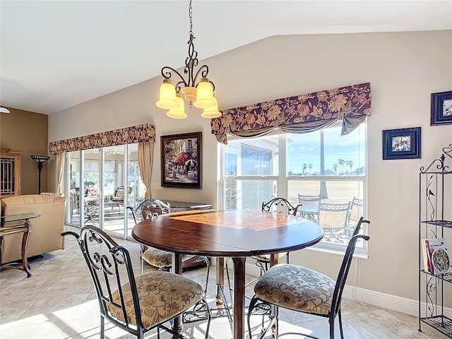 tiled dining room featuring lofted ceiling and a chandelier