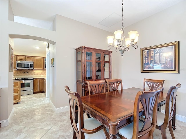 dining area featuring an inviting chandelier