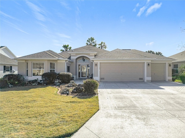 ranch-style house with a garage and a front yard