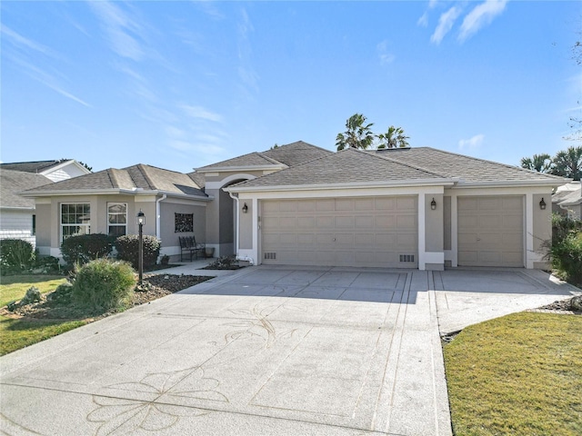 single story home with a garage and a front lawn
