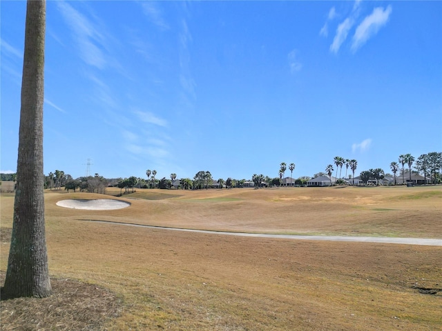 view of home's community featuring a lawn