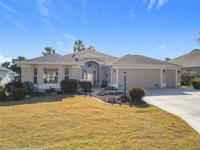 ranch-style home with a garage and a front yard