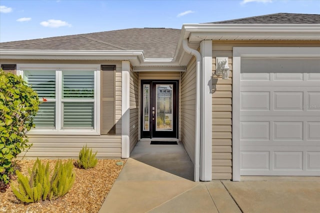 entrance to property featuring a garage