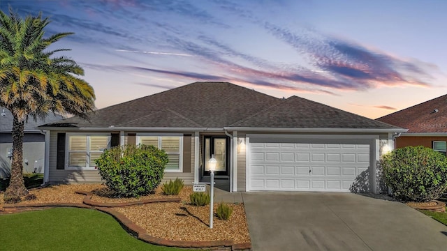 single story home featuring a garage