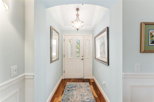 doorway featuring hardwood / wood-style floors and ornamental molding