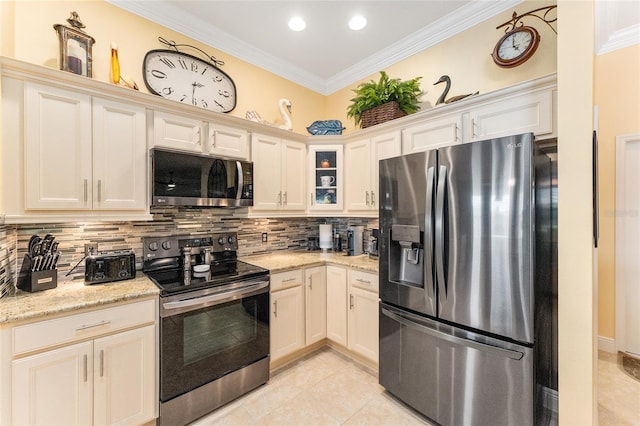 kitchen featuring crown molding, decorative backsplash, light stone countertops, appliances with stainless steel finishes, and light tile patterned flooring