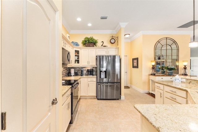 kitchen with black / electric stove, light stone counters, pendant lighting, and stainless steel refrigerator with ice dispenser