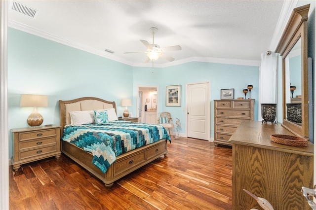 bedroom featuring dark hardwood / wood-style floors, vaulted ceiling, ceiling fan, and crown molding