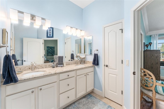 bathroom with vanity, tile patterned floors, and ornamental molding