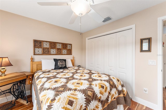 bedroom with wood-type flooring, a closet, and ceiling fan