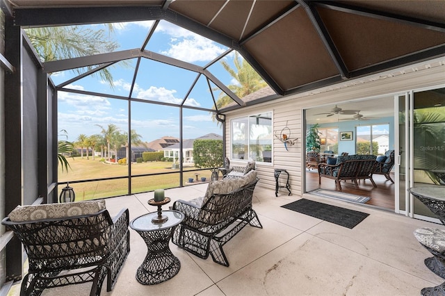 view of patio featuring a lanai