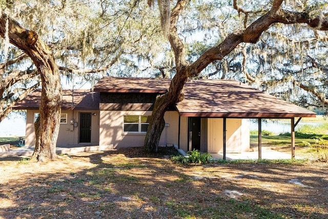 view of front of property with a carport